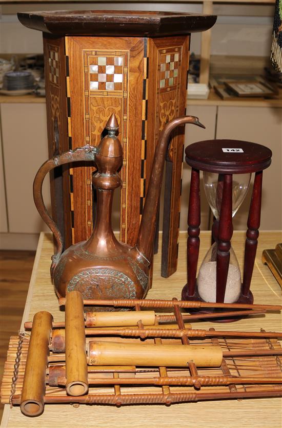 A mother of pearl inlaid table, coffee pot, bamboo musical instruments etc.